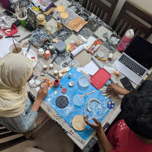 People working on clay